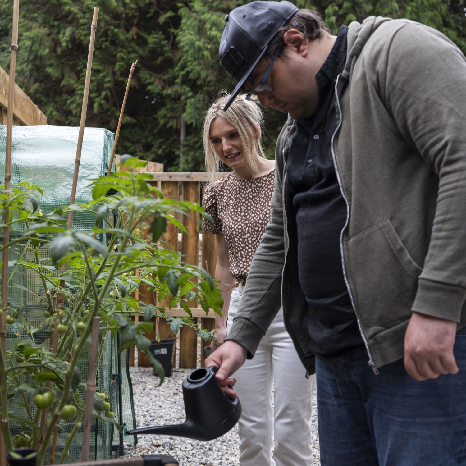 A care worker helping someone do gardening