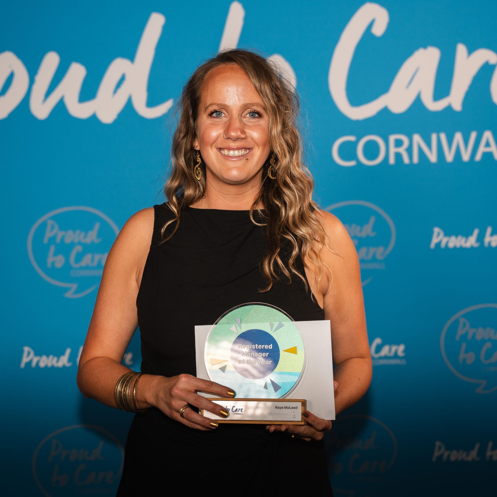 A woman with a care award